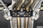 MMX Performance Underbody Chassis Brace installed on a BMW F8X M2, M2 Competition, M3, or M4, providing an additional 15mm of exhaust clearance while maintaining factory ground clearance and increasing chassis rigidity.