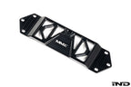 MMX Performance BMW F8X Underbody Chassis Brace on a white background, precision CNC machined from billet 6061-T6 aluminum to increase exhaust clearance, improve chassis rigidity, and provide a direct OEM-fit installation for the F87 M2, M2 Competition, F80 M3, and F82/F83 M4.