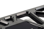 MMX Performance BMW F8X Underbody Chassis Brace on a white background, precision CNC machined from billet 6061-T6 aluminum to increase exhaust clearance, improve chassis rigidity, and provide a direct OEM-fit installation for the F87 M2, M2 Competition, F80 M3, and F82/F83 M4.