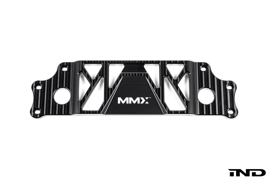 MMX Performance BMW G87 M2 Underbody Chassis Brace on a white background, precision CNC machined from billet 6061-T6 aluminum to provide additional exhaust clearance, increased chassis rigidity, and direct OEM-fit installation.