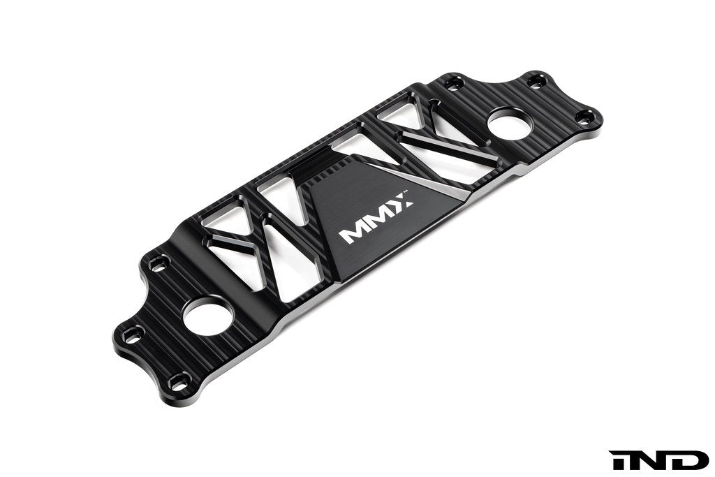 MMX Performance BMW G87 M2 Underbody Chassis Brace on a white background, precision CNC machined from billet 6061-T6 aluminum to provide additional exhaust clearance, increased chassis rigidity, and direct OEM-fit installation.