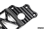MMX Performance BMW G87 M2 Underbody Chassis Brace on a white background, precision CNC machined from billet 6061-T6 aluminum to provide additional exhaust clearance, increased chassis rigidity, and direct OEM-fit installation.