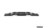 MMX Performance BMW G87 M2 Underbody Chassis Brace on a white background, precision CNC machined from billet 6061-T6 aluminum to provide additional exhaust clearance, increased chassis rigidity, and direct OEM-fit installation.