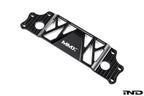 MMX Performance BMW G87 M2 Underbody Chassis Brace on a white background, precision CNC machined from billet 6061-T6 aluminum to provide additional exhaust clearance, increased chassis rigidity, and direct OEM-fit installation.