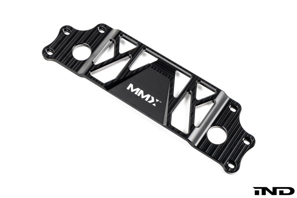 MMX Performance BMW G87 M2 Underbody Chassis Brace on a white background, precision CNC machined from billet 6061-T6 aluminum to provide additional exhaust clearance, increased chassis rigidity, and direct OEM-fit installation.
