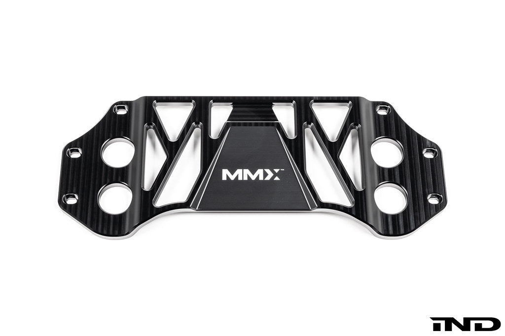 MMX Performance BMW G8X M3 and M4 billet 6061-T6 aluminum underbody chassis brace on a white background, designed to increase exhaust clearance and improve chassis rigidity for G80, G81, G82, and G83 models.