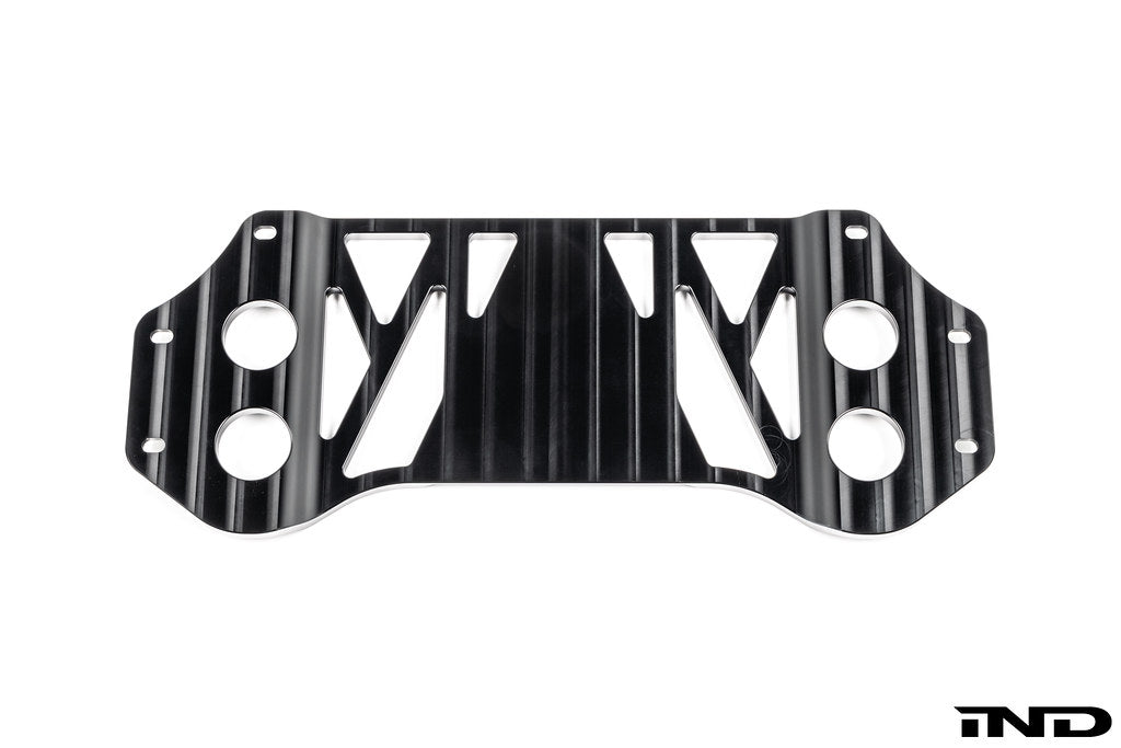 MMX Performance BMW G8X M3 and M4 billet 6061-T6 aluminum underbody chassis brace on a white background, designed to increase exhaust clearance and improve chassis rigidity for G80, G81, G82, and G83 models.
