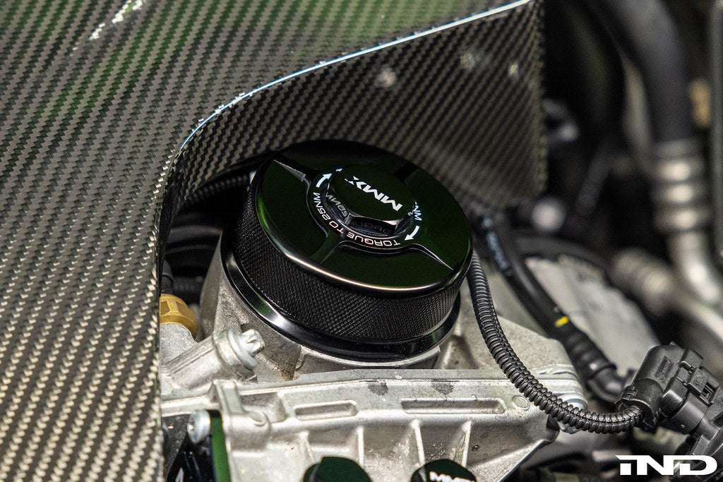 MMX Performance BMW N20, N5X, S55 billet oil filter housing cap installed on engine exterior.