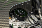 MMX Performance BMW N20, N5X, S55 billet oil filter housing cap installed on engine exterior.