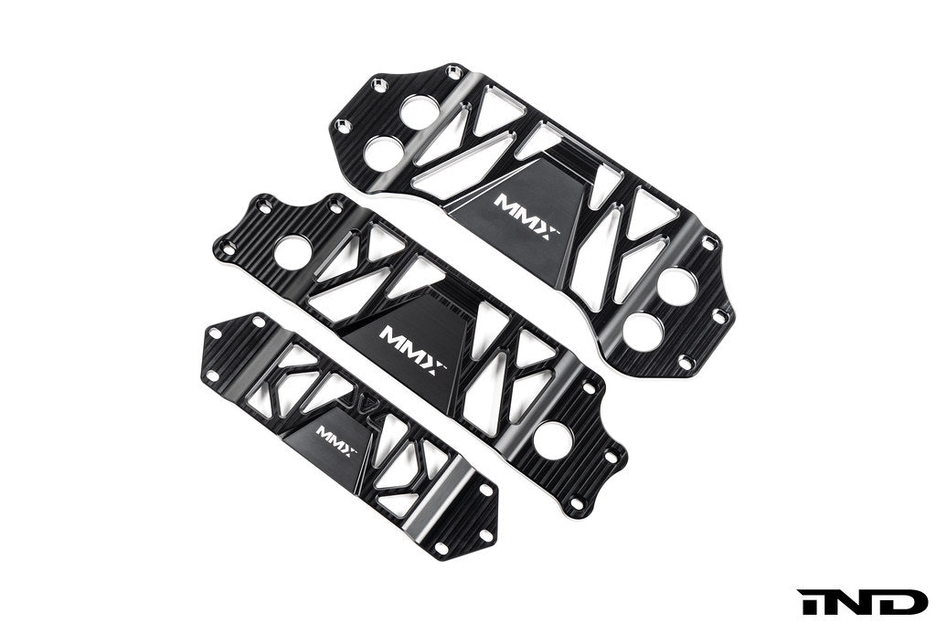 MMX Performance underbody chassis brace lineup on a white background, featuring billet 6061-T6 aluminum chassis braces for the BMW F8X M2/M3/M4, G87 M2, and G8X M3/M4 platforms, engineered to increase exhaust clearance, improve chassis rigidity, and provide direct OEM-fit installation.