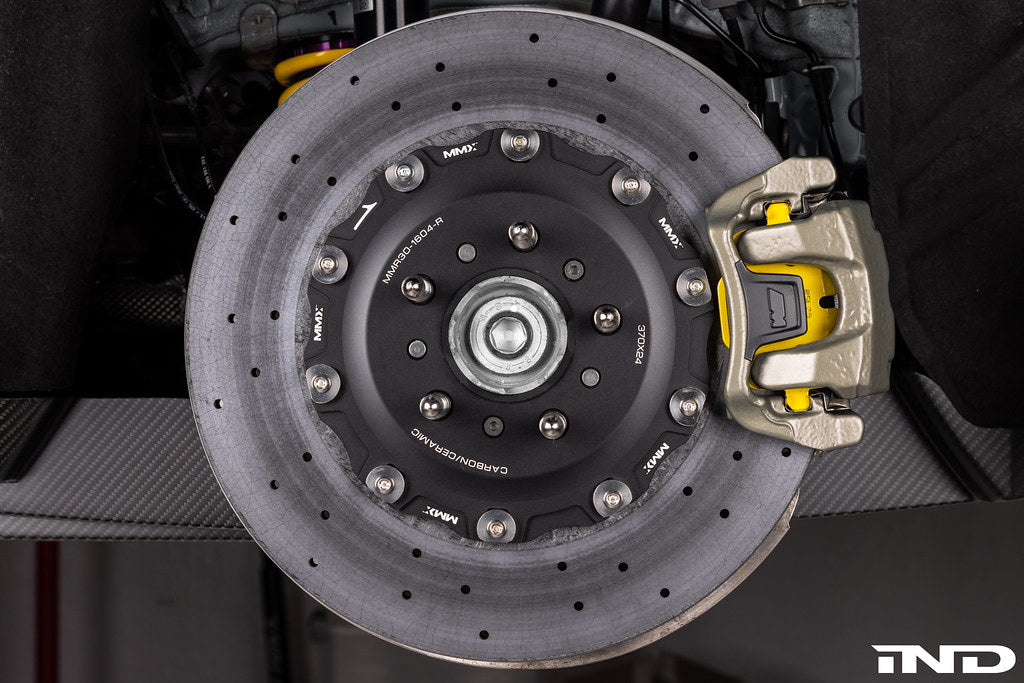 MMX Performance G8X rear 370x24mm carbon ceramic brake rotor installed on M2, M3, M4 models, showcasing high-performance brake components.