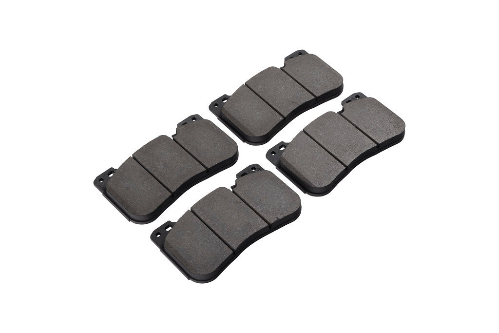 Race Technologies F90 M5 Competition street brake pad set with iron rotors, shown in white, designed for high-performance BMW M5 brakes.