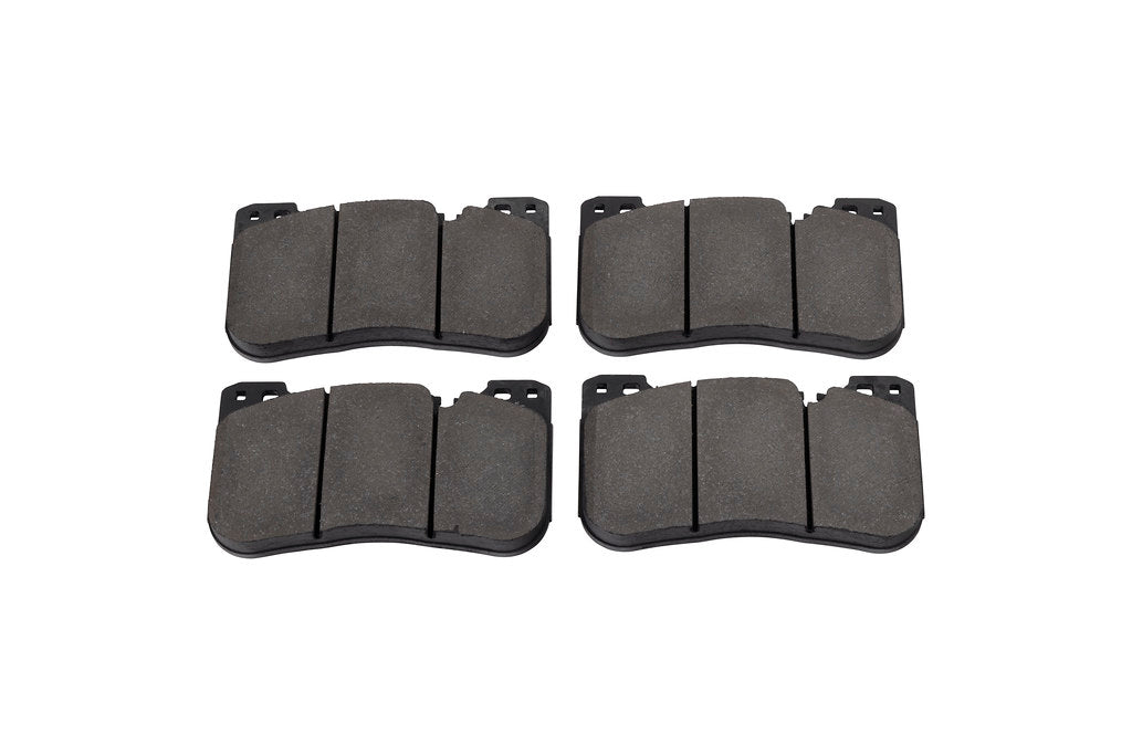 Race Technologies F90 M5 Competition street brake pad set for iron rotors, shown in white, designed for high-performance BMW M5 brakes.