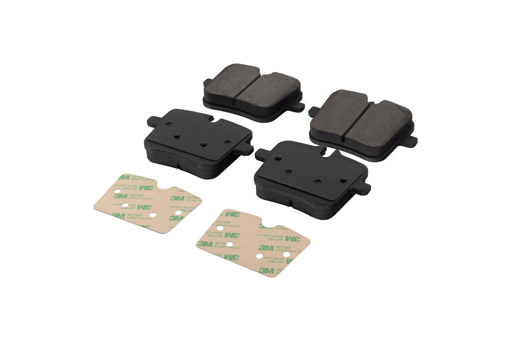 Race Technologies F90 M5 Competition street brake pad set with iron rotors, showing white brake pads and detailed contact surfaces.
