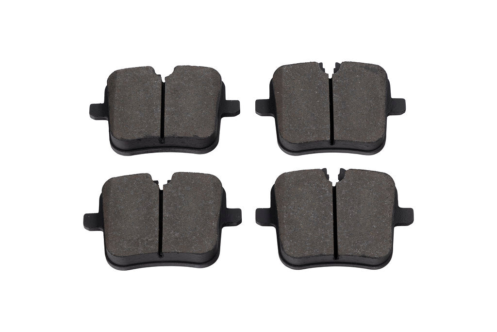 Race Technologies F90 M5 Competition street brake pad set for iron rotors, shown with white brake pads and hardware.