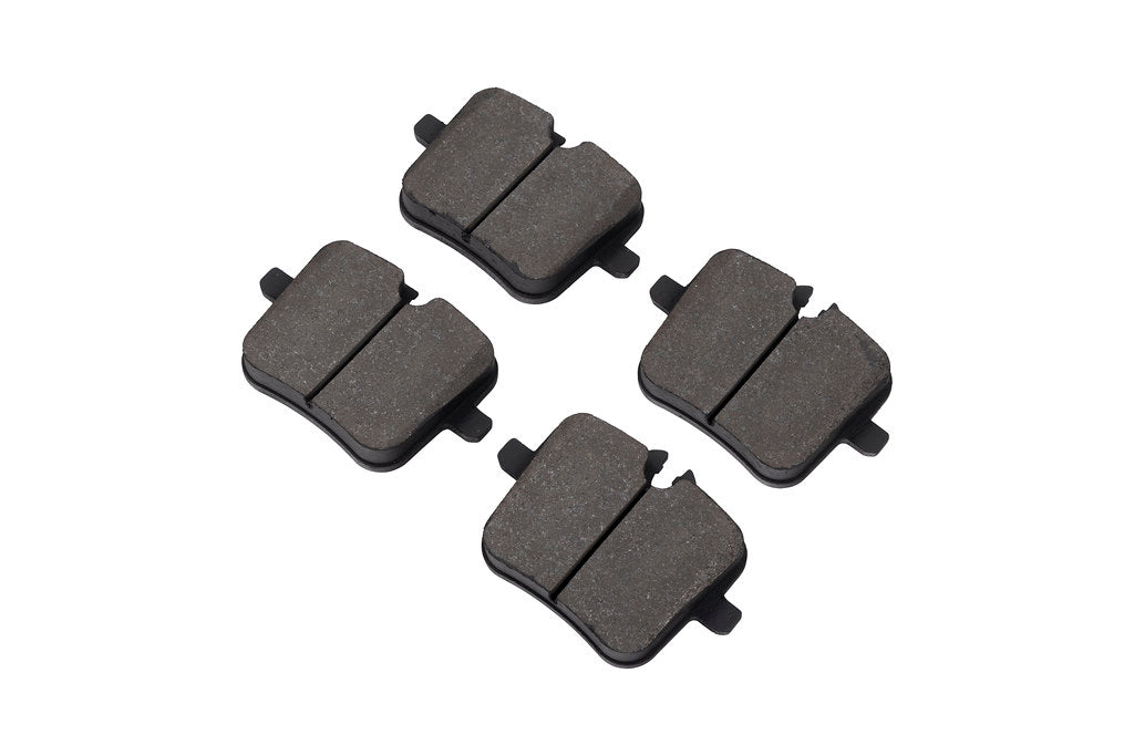 Race Technologies F90 M5 Competition street brake pad set for iron rotors, shown in white, designed for high-performance M5 brakes.