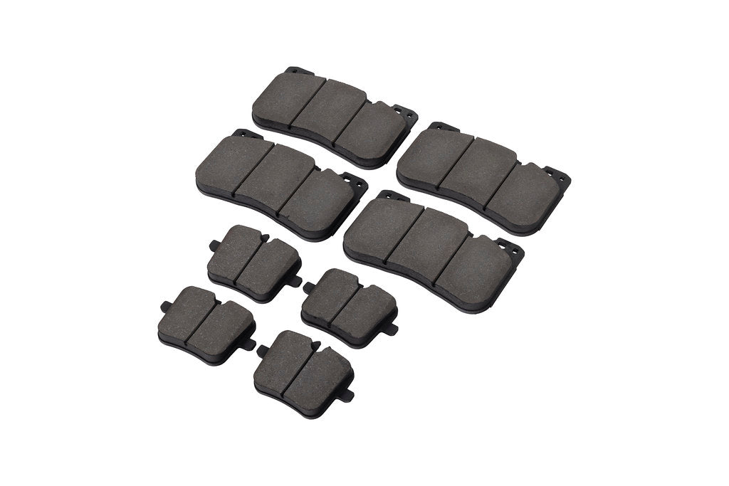 Race Technologies F90 M5 Competition street brake pad set with white pads on iron rotors, designed for high-performance BMW M5.