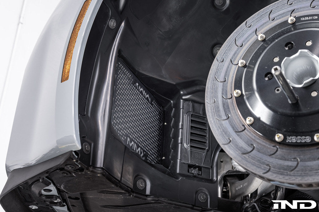 RKP enhanced clearance front fender liners installed on BMW G8X M2 M3 M4 showing increased wheel spacer and tire clearance