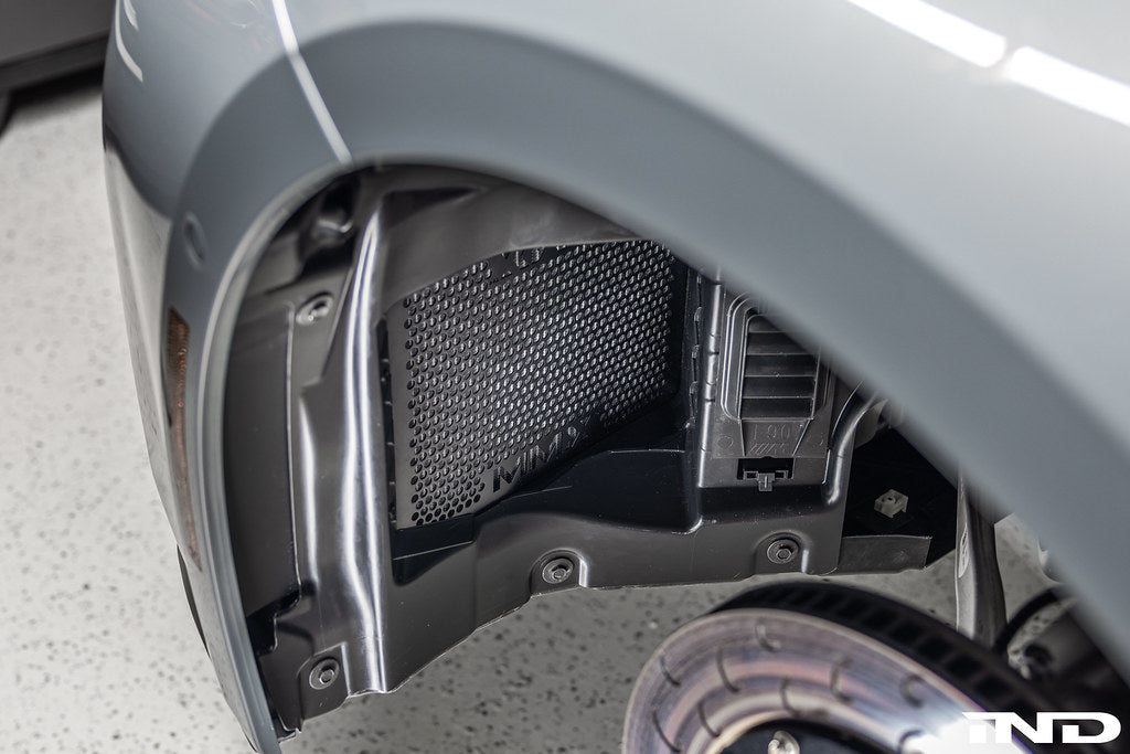 RKP G8X M2 M3 M4 Enhanced Clearance Front Liner Set installed on vehicle with wheel spacers for improved fit and clearance.