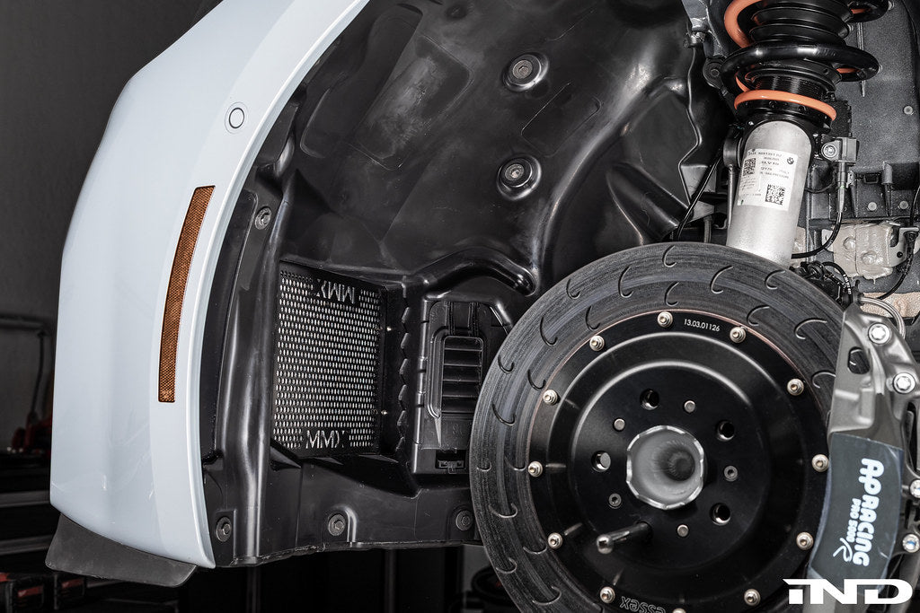 RKP G8X M2/M3/M4 enhanced clearance front liner set installed on vehicle with wheel spacers for improved fit and clearance.