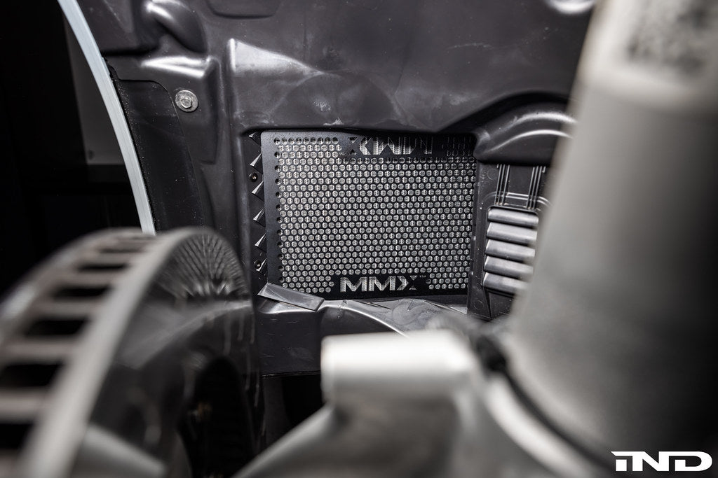 RKP G8X M2/M3/M4 exterior front liner set with wheel spacer clearance installed on a vehicle.