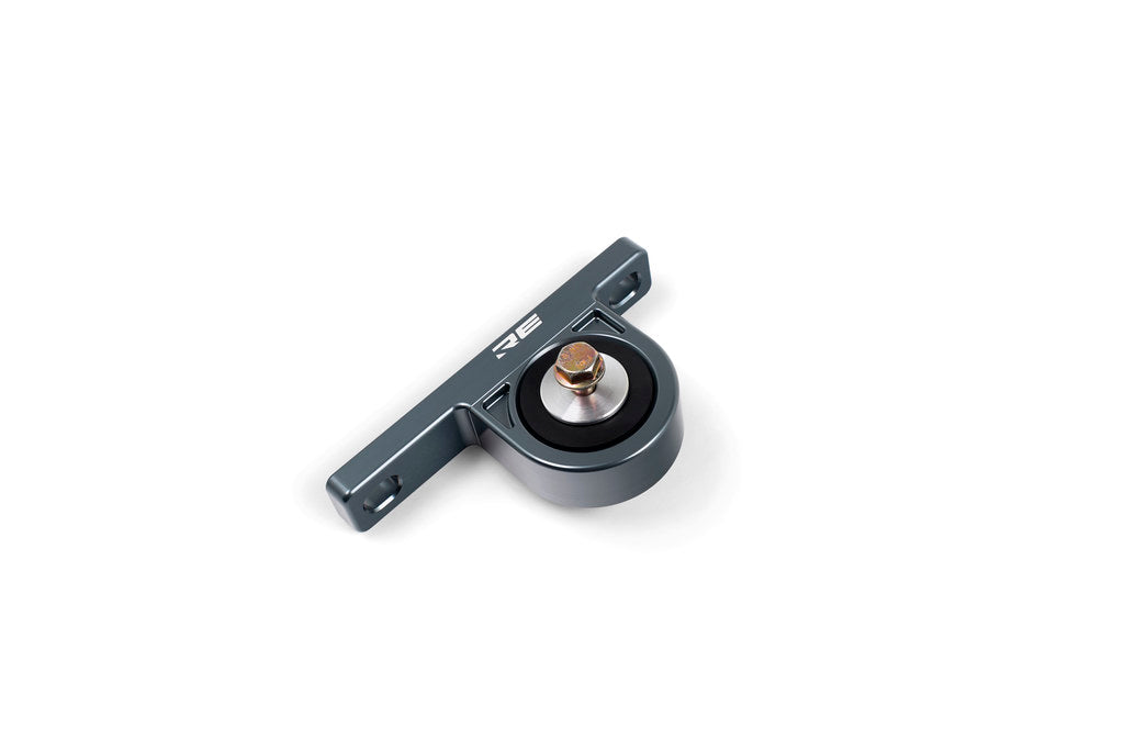 Rogue Engineering rear muffler hanger for BMW E36, E46, E9X models, white exhaust hanger attached to the vehicle's rear exhaust system.