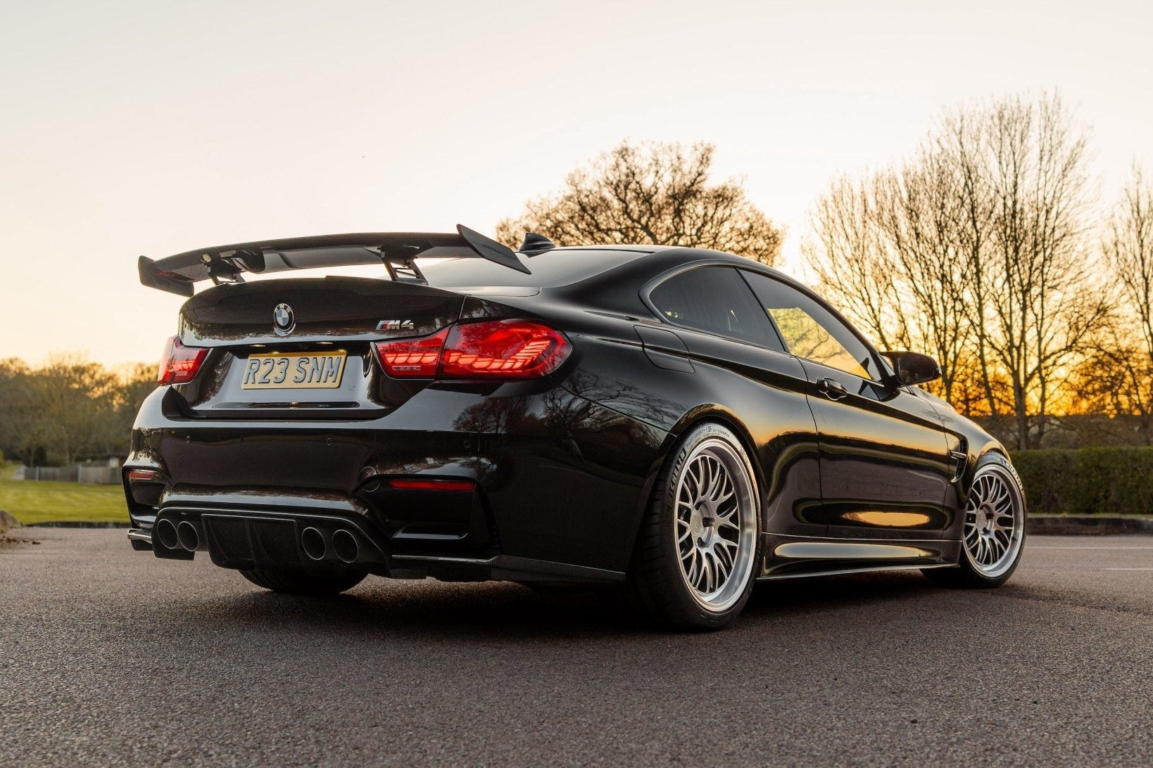 TREVORA TR87 V2 Carbon Rear Wing mounted on flat trunk, showcasing lightweight pre-preg carbon fiber exterior car aerodynamic part.