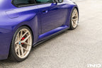 TREVORA carbon flat side skirts installed on a BMW G87 M2