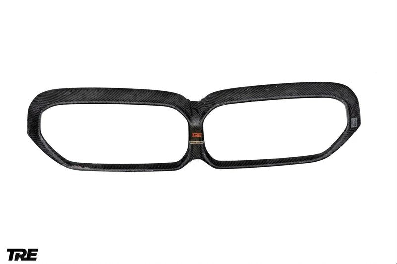 TREVORA G30 5-Series F90 M5 LCI pre-preg carbon fiber grille surround, viewed from the backside on white background.