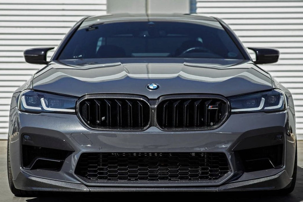 TREVORA G30 5-Series F90 M5 LCI pre-preg carbon fiber exterior grille surround installed on front of vehicle.