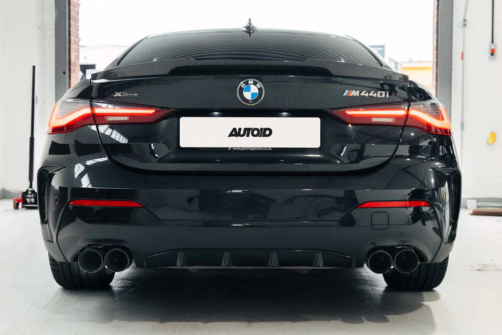 TREVORA G42 and G2X 3 and 4 Series Cerakote Black exhaust tips installed on vehicle exterior, showcasing sleek black finish.