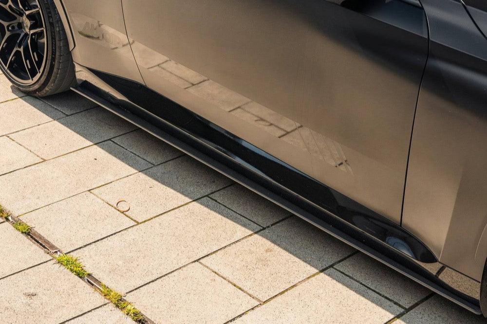 TREVORA G42 2-Series M240i carbon fiber side skirt set installed on a vehicle, showcasing sleek exterior enhancement.