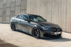 TREVORA BMW G42 M240i ID-01 full carbon body kit with side skirts installed on the exterior of the car.