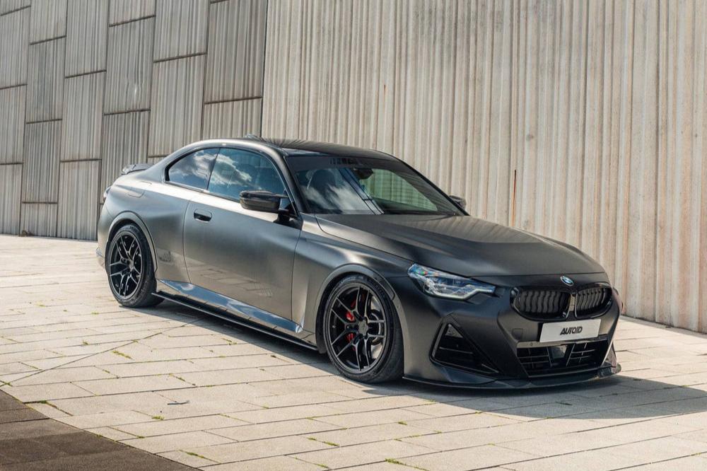 TREVORA BMW G42 M240i ID-01 full carbon body kit with side skirts installed on the exterior of the car.