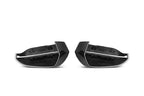 Pair of TREVORA G60 G61 5-Series and G45 X3 pre-preg carbon fiber mirror covers on a white background.