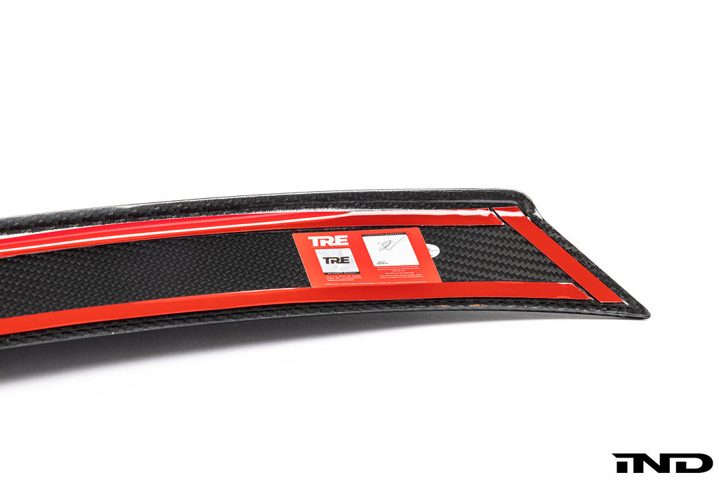 TREVORA G80 M3 Carbon Fiber PR-1 rear trunk spoiler mounted on white exterior car, showcasing sleek aerodynamic design.
