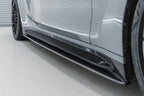 Close-up of TREVORA G82 G83 M4 carbon fiber side skirts installed on the right front exterior, showcasing the sleek design.