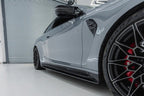 TREVORA G82 M4 Carbon Fiber Side Skirts installed on vehicle, showcasing sleek exterior design and high-quality pre-preg carbon fiber finish.