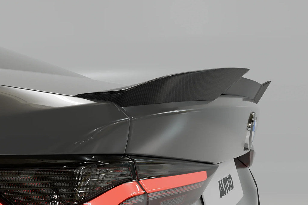 TREVORA G82 M4 Carbon Fiber PR-1 rear trunk spoiler installed on BMW G82 M4, showcasing its sleek, aerodynamic exterior design.