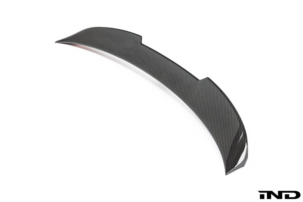 TREVORA G82 M4 carbon fiber PR-1 rear trunk spoiler on a white BMW G82 M4 exterior, showcasing aerodynamic design.