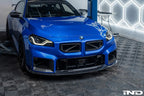 TREVORA G87 M2 carbon front splitter with winglets installed on a car, showcasing aerodynamic exterior enhancement.