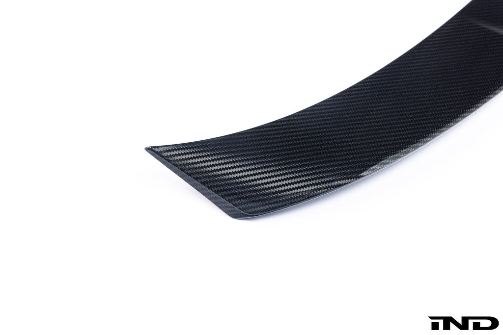 TREVORA G87 M2 Carbon ID-01 rear spoiler mounted on a white background, showcasing its aerodynamic design and sleek carbon fiber finish.