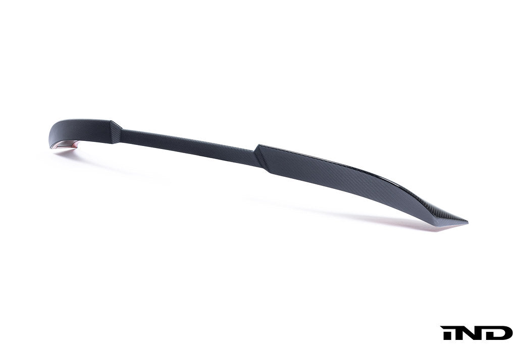 TREVORA G87 M2 Carbon ID-01 rear spoiler installed on a car, showcasing sleek aerodynamic design on a white background.