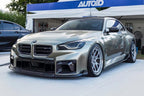 TREVORA G87 M2 carbon front air duct set installed on a BMW G87 M2 exterior, showcasing lightweight performance parts.