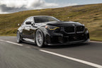 TREVORA G87 M2 Carbon side skirt set installed on a BMW G87 M2 exterior car enhancement.