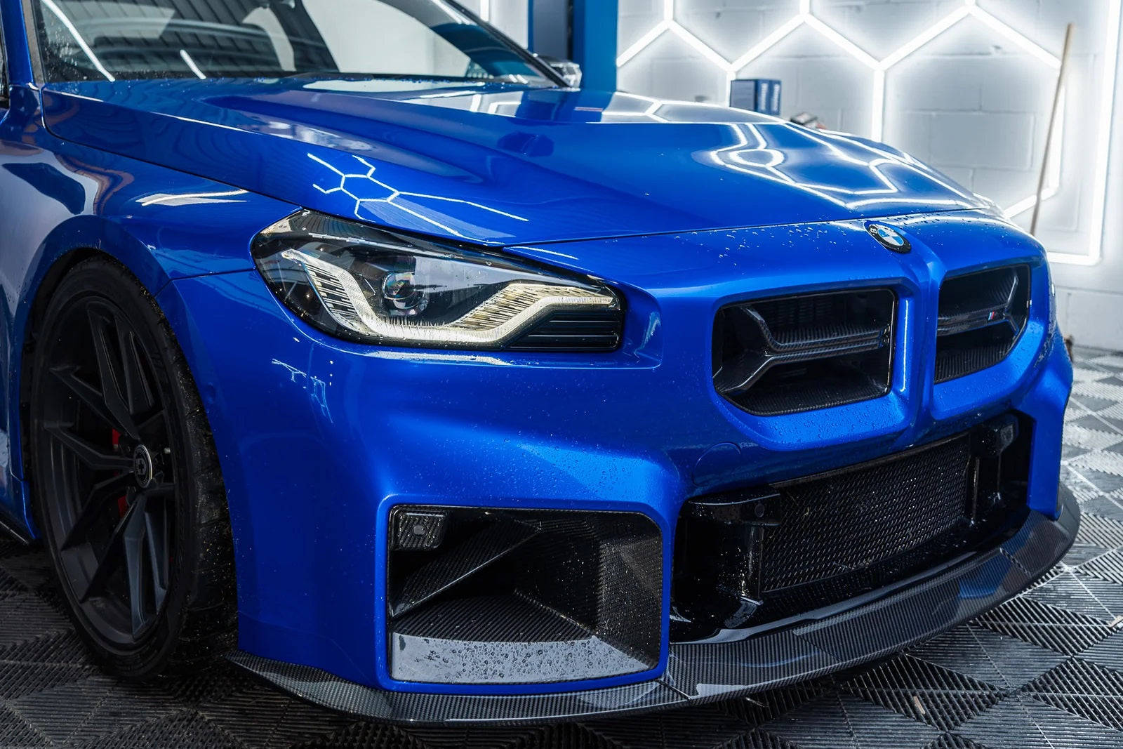 TREVORA BMW G87 M2 TR87 Ultimate Carbon Kit exterior with flat front splitter installed on the car.