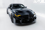 TREVORA BMW G87 M2 TR87 Ultimate Carbon Kit exterior with flat front splitter installed on black car, showcasing sleek design.
