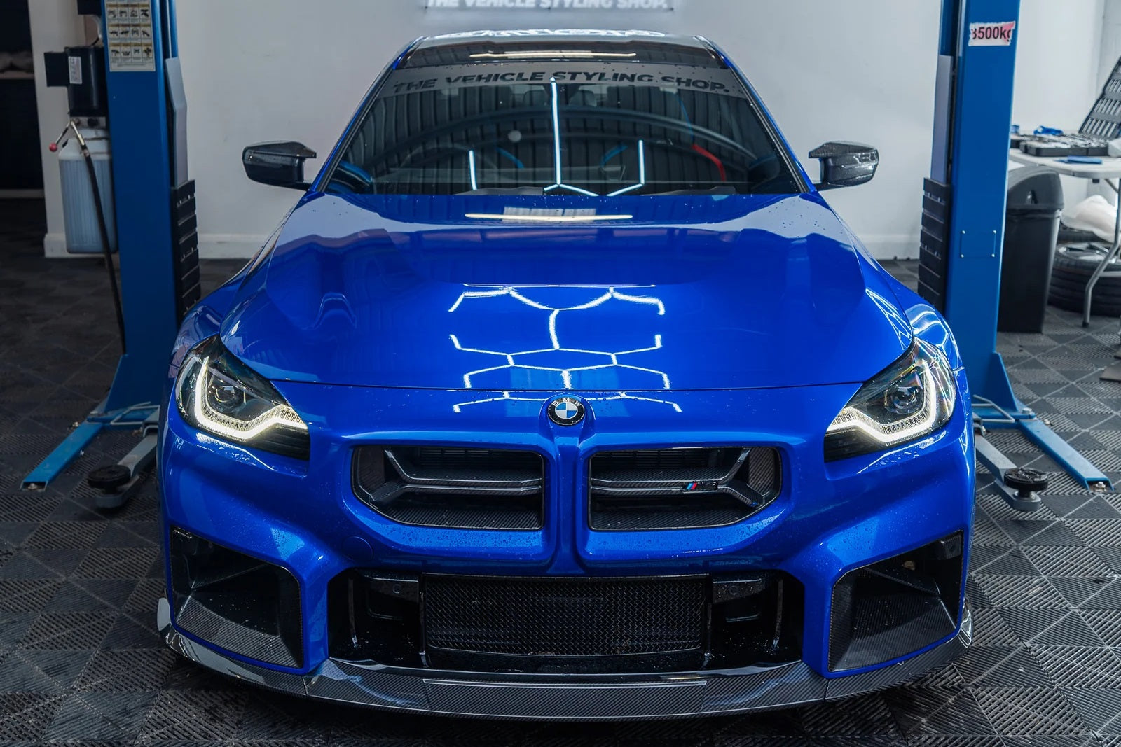TREVORA BMW G87 M2 TR87 Ultimate Carbon Kit exterior with flat front splitter installed on the vehicle.