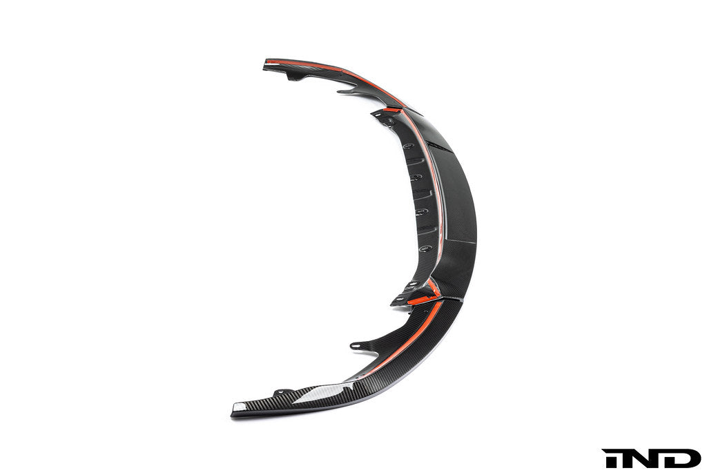 TREVORA G87 M2 TR87 carbon flat front splitter installed on white exterior of car, enhancing aerodynamics and sporty look.