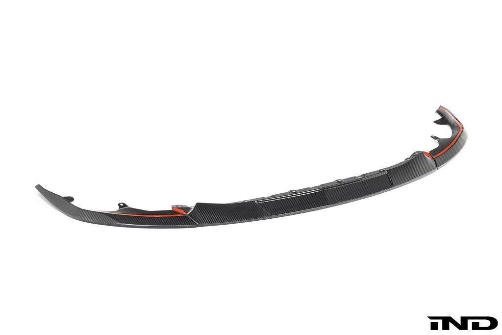 TREVORA G87 M2 TR87 carbon flat front splitter installed on a white car's exterior, enhancing aerodynamics and sporty look.